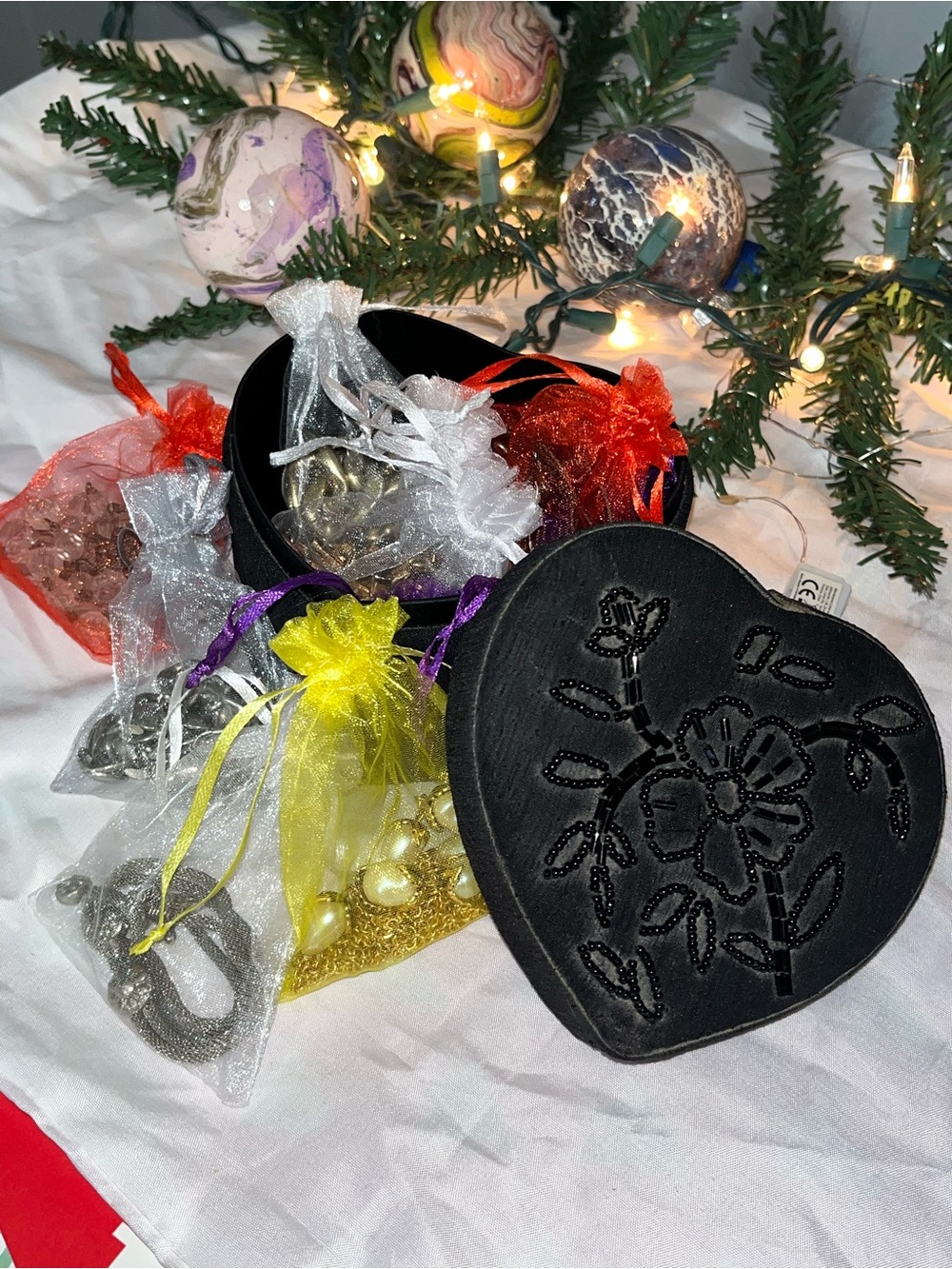 Heart Embroidered Black Jewelry Box with Assorted Pouches of jewelry.